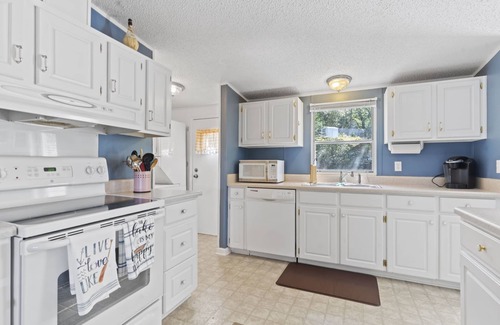 Greenwood House | Family - Friendly Lakefront Home with a Covered Boat-slip.