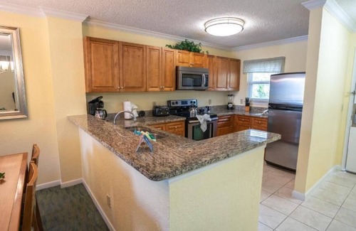 Florida Central Atlantic Coast Hotel | Family Group Getaway NEAR DISNEY! Three Comfy Suites, 4 Pools, Shuttle to Parks