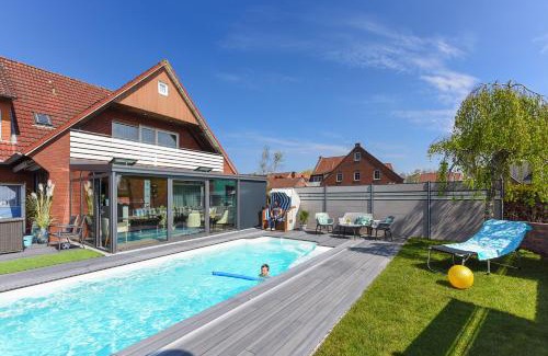 Bensersiel Apartment | Ferienwohnung Haus zum Seehund mit Pool und Frühstücksoption