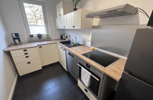 Sudstadt Apartment | Ferienwohnung NORDLICHT mit Balkon und Smart-TV