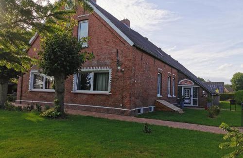 Roggenstede Apartment | Ferienwohnung Nordsee Gulfhof Dornum - mit großem Garten