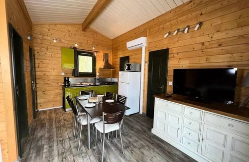 Leval Ski Chalet | Flower Camping du Lac de la Seigneurie * - Chalet Savania PREMIUM46 34 m2 (2 bedrooms) + covered terrace of 13 m2 + TV + reversible air conditioning 6 people