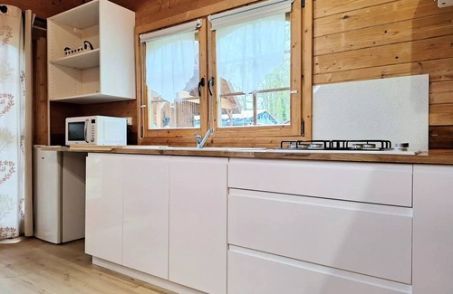 Leval Ski Chalet | Flower Camping du Lac de la Seigneurie * - Chalet CONFORT Alpina 28 m2 (1 bedroom + 1 mezzanine bedroom) + wooden stove(032a) 4 persons