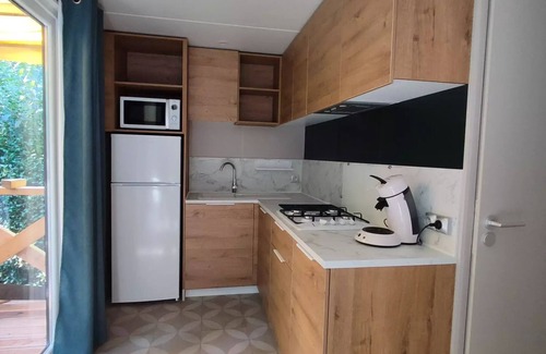 Leval House | Flower Camping du Lac de la Seigneurie * - Cottage Ohara Premium Garden Side 30m2-2 bedrooms 1 bed160-Semi-covered terrace- Forest view- LV 4 people