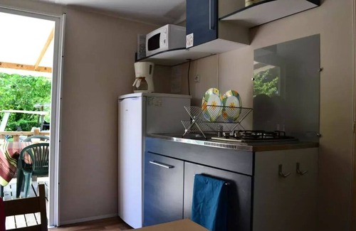 Grignan House | Flower Camping LES TRUFFIERES * - Mobile home Domino STANDARD 24m2 - 2 bedrooms + TV + semi-covered terrace 10m2 4 people