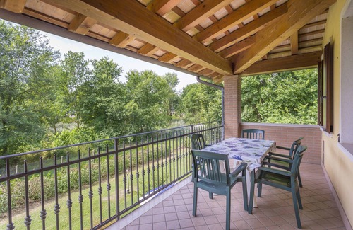 Palazzolo dello Stella Apartment | Folaghe 3, apartment with terrace overlooking the grove