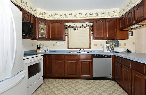 Sandpiper Pines House | FREE DAILY ACTIVITIES! Lovely 4 bedroom + Den, (Two Master Bedrooms) 3.5 bath home, located on the canal, with boat dock, 2 car garage,just a short walk to the lifequarded beach.