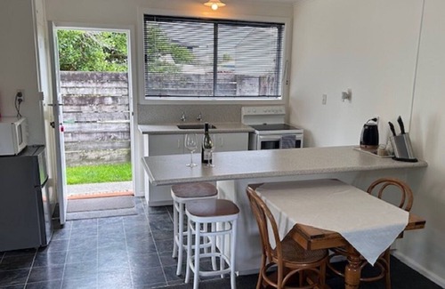 Napier House | Fully self contained unit with separate bedroom on beachfront property,