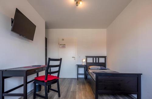 Schortens Apartment | Gästehaus Olympia Wilhelmshaven - Moderne Einzelzimmer mit eigenem Bad für Monteure
