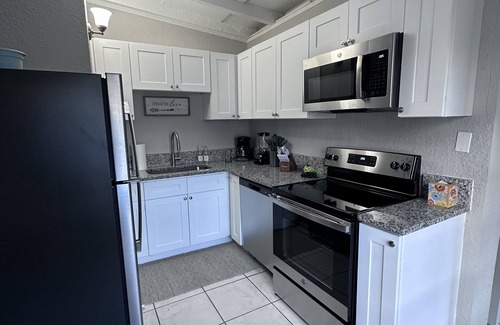 East Tampa House | Get cozy, 4 bedrooms. Close to Clarence Fort Park, 4 miles to Busch Gardens.