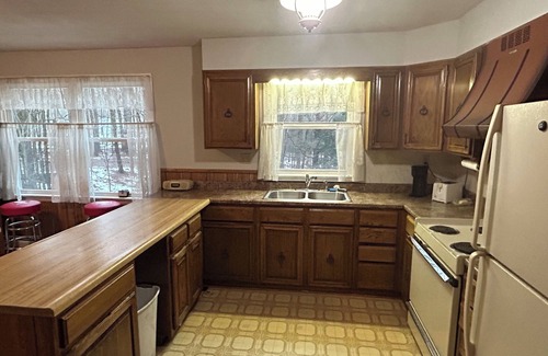 Taberg House | Glenmore Creek, ranch style home located on 10, mostly wooded, private acres.