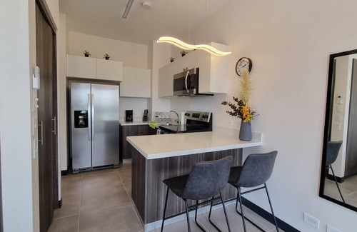 Alajuela Apartment | Golden Loft with AC, Pool, 5 min from the Airport!
