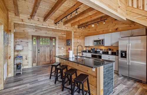 Chalet Village North Cabin | Grizzlies Den 4 Bedroom Cabin by RedAwning