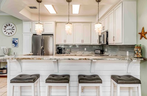 Dauphin Island Condo | Ground-floor condo with beachfront access, pool, patio, & 2 full kitchens