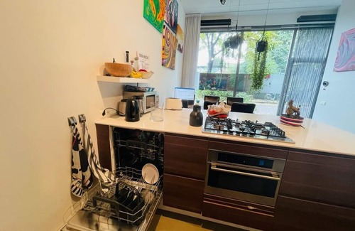 Weesperzijde Apartment | Ground level illuminated entire loft with huge garden!nDowntown area near metro
