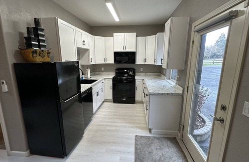 Meadow Glade Cottage | Guest House nestled in the trees with large deck, full kitchen, and laundry