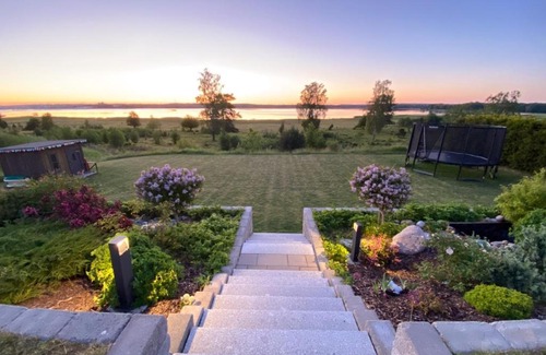 Nykoping Municipality Villa | Guestly Homes - 4BR Serene Villa with Garden