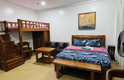 Trece Martires Apartment | Happy Stays E - 300mbps - 65"TV NetFlix, Disney - Washer
