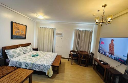 Trece Martires Apartment | Happy Stays E - 300mbps - 65"TV NetFlix, Disney - Washer