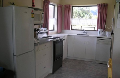 Tairua House | Harbour Views 30 metres from the sea and sand beach.