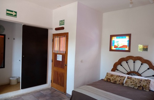 La Ribera Bed & Breakfast | HdP: Room #3 Library with one queen size bed and one sofa bed in separate room