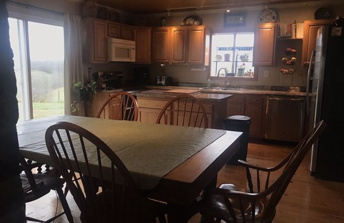 Carlisle House | Hilltop Farmhouse with sunrise sunset porch overlooking hills and holler