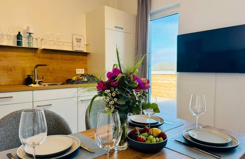 Tossens Apartment | HimmelFrei - Holiday apartment with water view. Sauna. Two roof terraces.