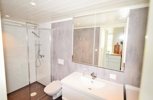 Vestbygd House | Holiday home "Strandheim", top property with sea view, sunny location in front of Borhaug harbor, southern Norway, 7 adults, great facilities, completely renovated and rebuilt in 2020, kitchen and open living area, WLAN, 4 bedrooms, 2 shower-bathr.