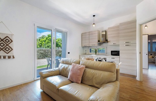 Arona House | Holiday Home 'Villa Lilia Appartamento Verde' with Shared Garden and Wi-Fi