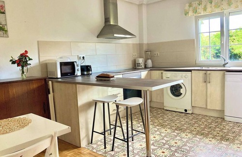 Aviles House | Homerez - Charming House in Bastian, Garden