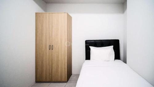 Sidoarjo Apartment | Homey 2BR Apartment at Suncity Residence By Travelio