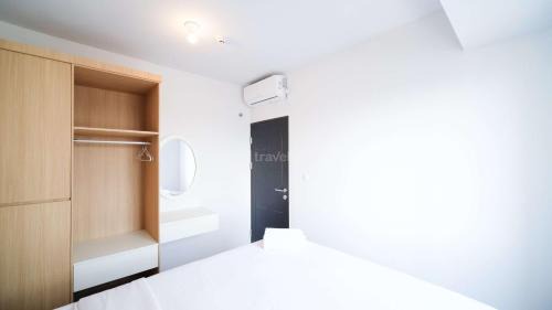 Sidoarjo Apartment | Homey and Comfy 2BR Apartment at Suncity Residence By Travelio