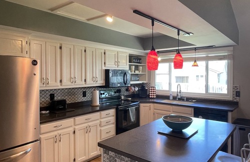 Wichita House | Hot Tub - Pool Table - Fire Pit - Family Friendly! Hosted by Homes by CNJ.