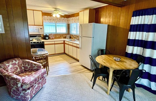 Prudenville Cabin | Houghton Lake cabin with garage game room lounge. No cleaning fees.