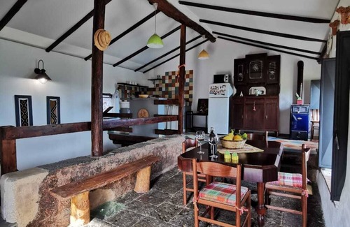 Santa Venerina Cottage | House surrounded by greenery surrounded by olive trees lemons oranges and chestnut trees
