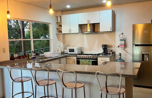 Santa Tecla House | house with a beautiful sea view in enchanting SurfCity with WiFi, AC and Pool.