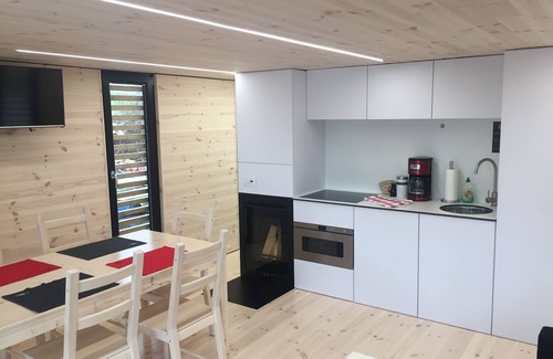 Rustersiel Boat Rental | Houseboat HT 4; with fireplace for 4 people in an idyllic location in Wilhelmshaven