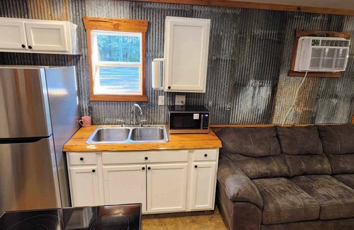 Fairbanks House | Hunters & Heroes Hideaway. Cozy barn studio in tranquil Loch Arbor area.