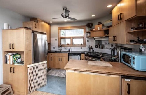 Holland House | Hygge Hideaway with gas fireplace, fenced yard, and eco friendly products