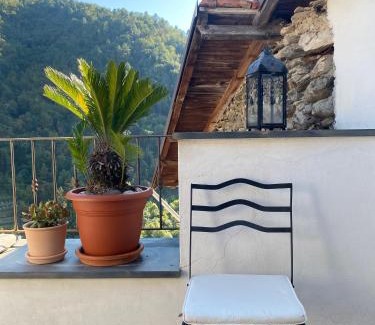 Pigna Villa | Iconic Italian Townhouse w Rooftop Terrace & Mountain View, Pigna