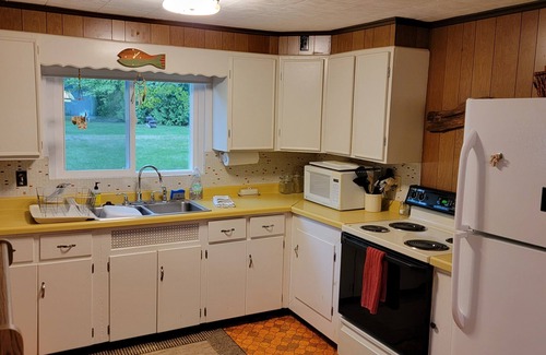 Lake Leelanau Cottage | In the narrows on Lake Leelanau, pet friendly, sleeps 8, and a dock!