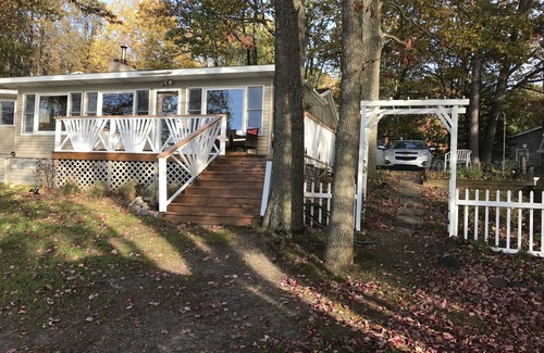 Rose City House | Incredible sunsets await in this Northern Michigan Lake front home.