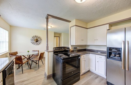Beaumont Apartment | Indoor fireplace with patio and pool table