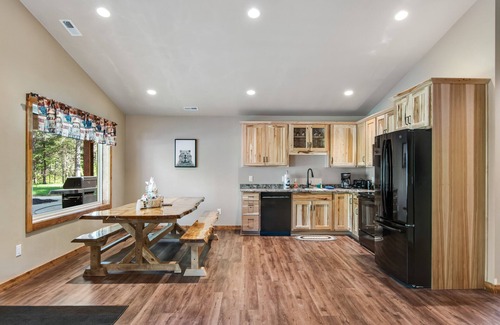 Conover House | Inviting dog-friendly cabin with hot tub, fireplace, patio, grill, central AC, & W/D
