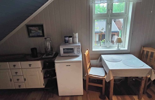 Sarpsborg House | Island house room Shared entrance with hosts Two single beds + sofa bed Small kitchen