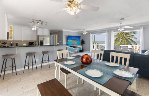 Bay Point House | Key West Beach House with heated pool, tiki, and dock.♿︎