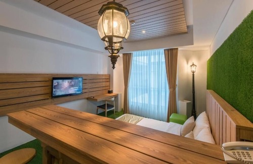 Downtown Kuta Hotel | King Bed Thematic Room in Kuta Beach Area