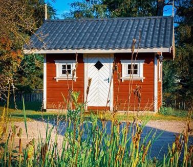Skien House | Koselig hytte langs elven