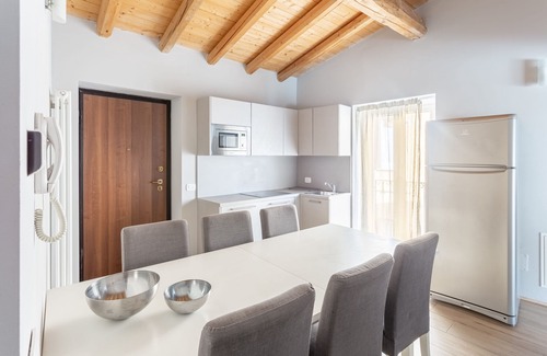 Orino Apartment | La Posteria Penthouse 7 by icasamia.it