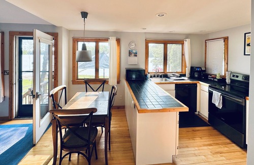 Traverse City House | Lakefront 4bdrm House Dock & Deck WiFi AC near Traverse City & Interlochen Art+
